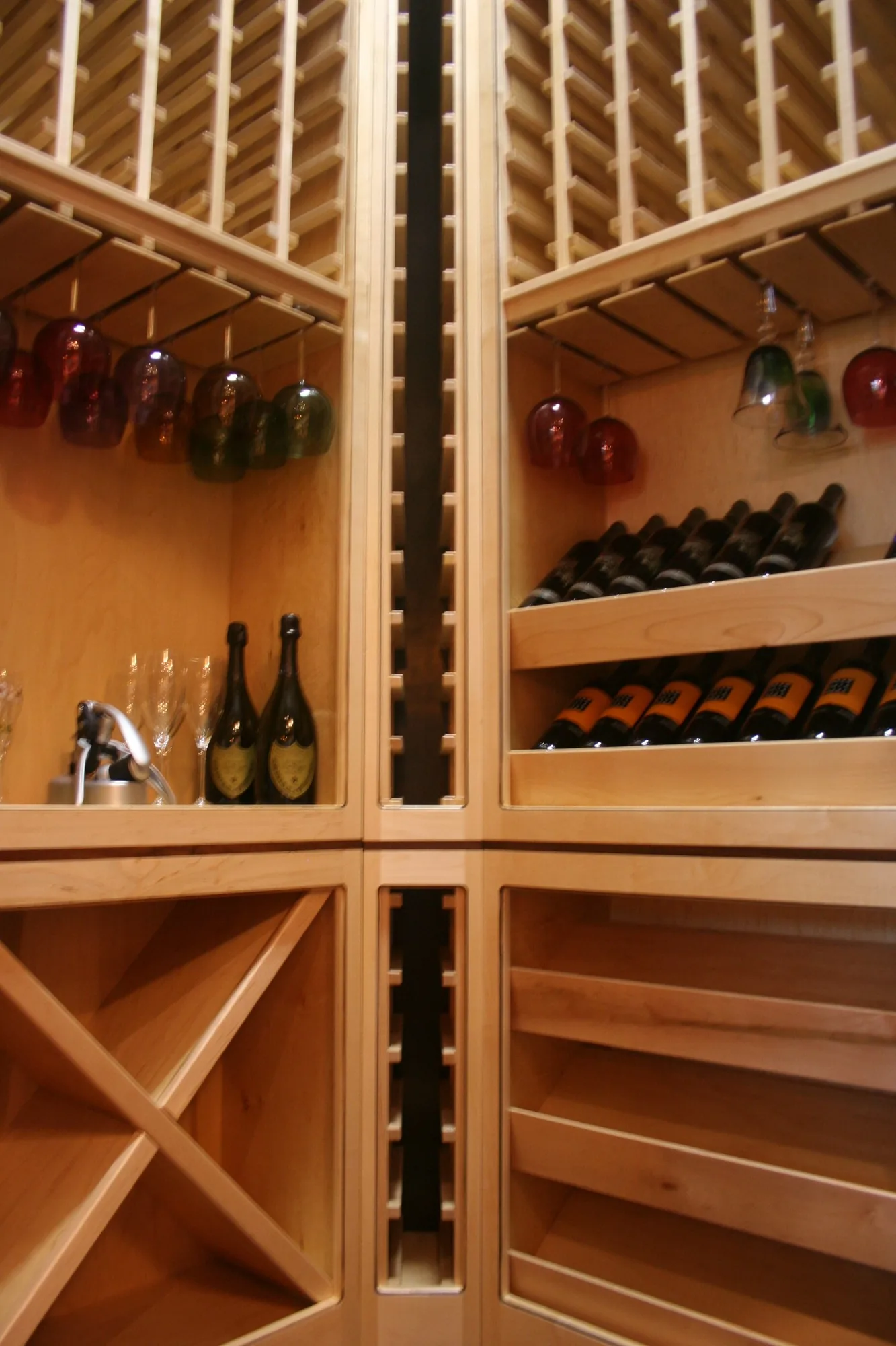 Maple wine racking with bottle slots, glass hangers, and a diamond bin.